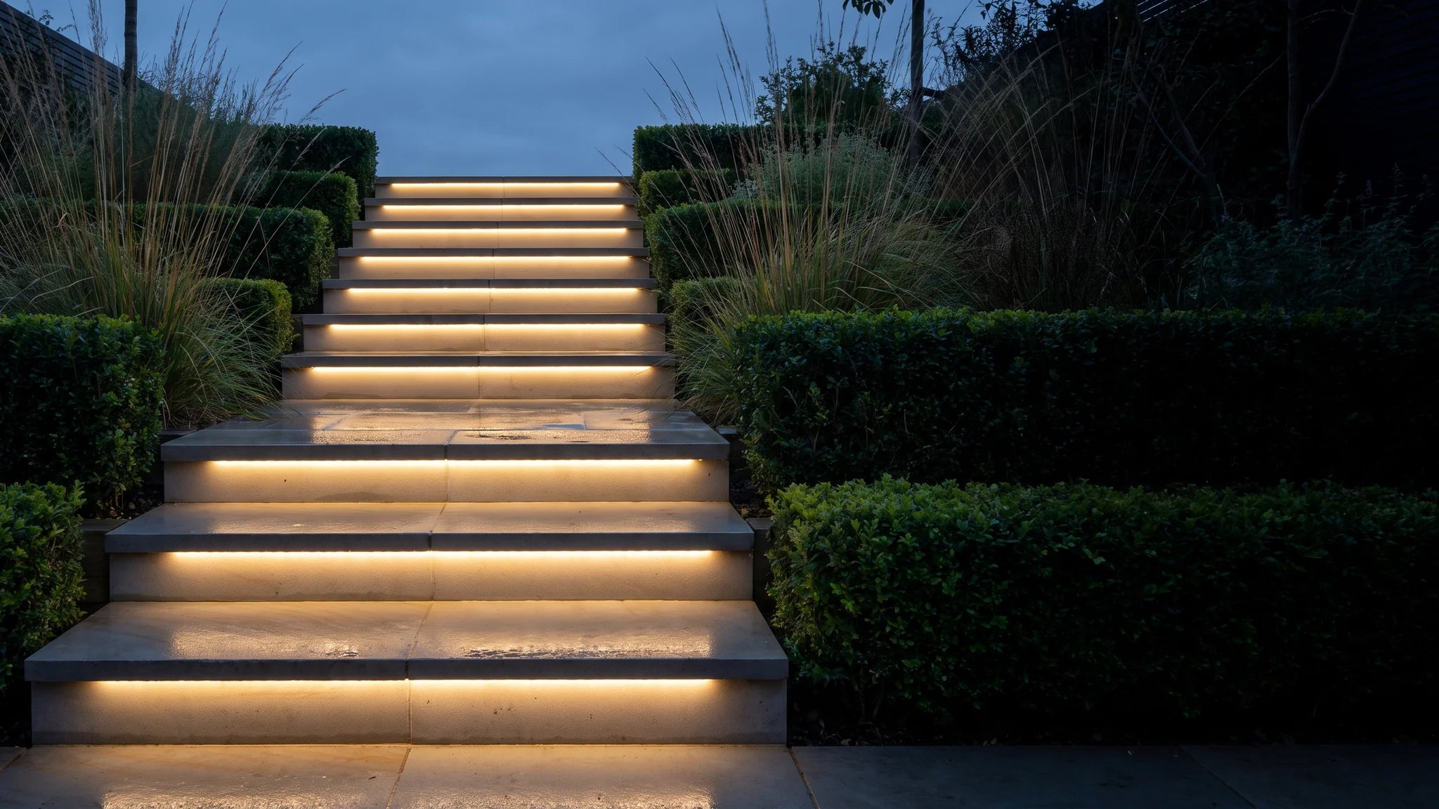 Warm white LED lighting around landscaped garden steps
