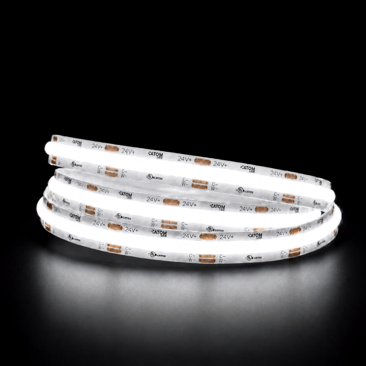 Daylight 5000K COB LED strip illuminated in a coil against a black background