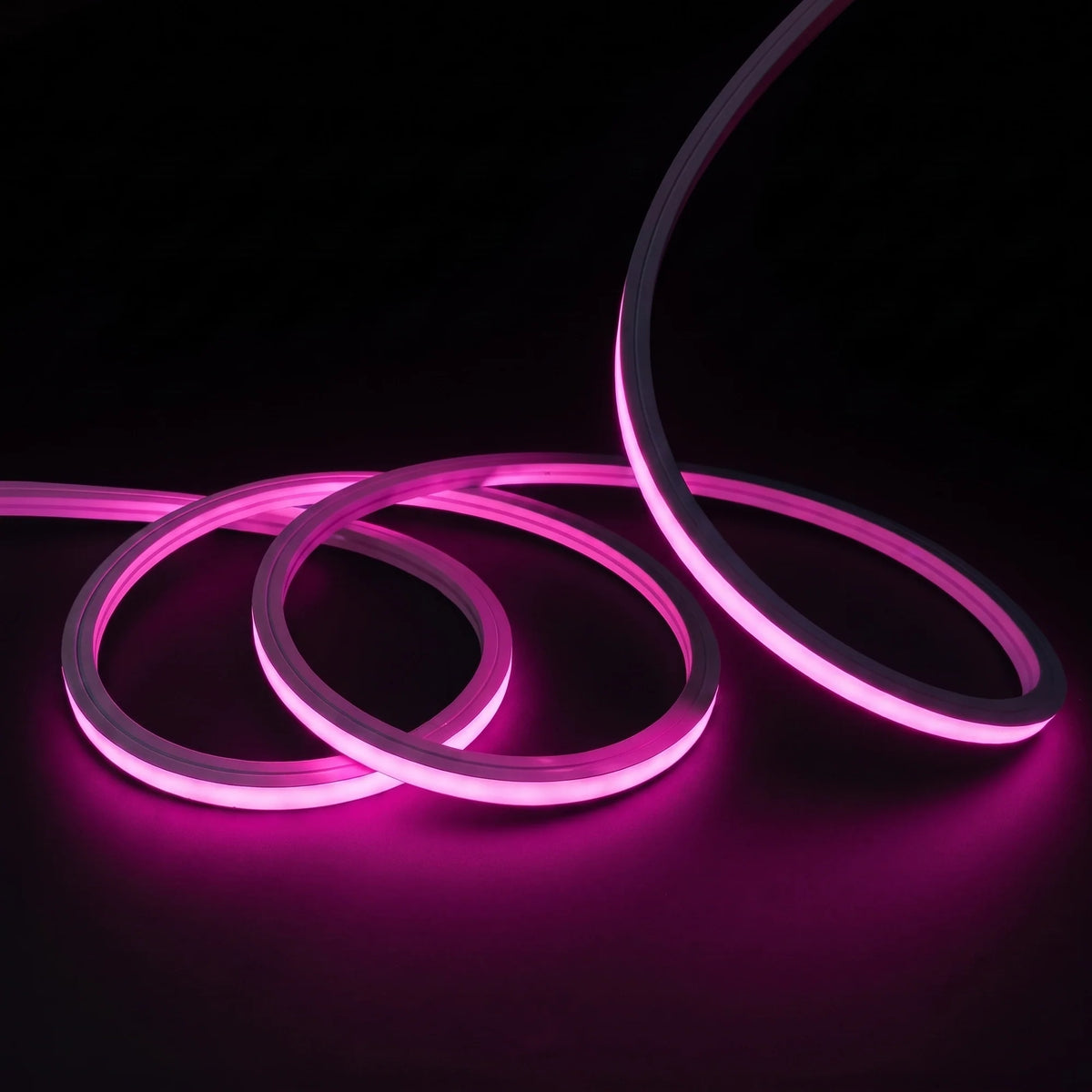 Pink LED Neon Flex 15x15mm Top Bend, overlapping offset coils with raised arc and colour glow on a black surface