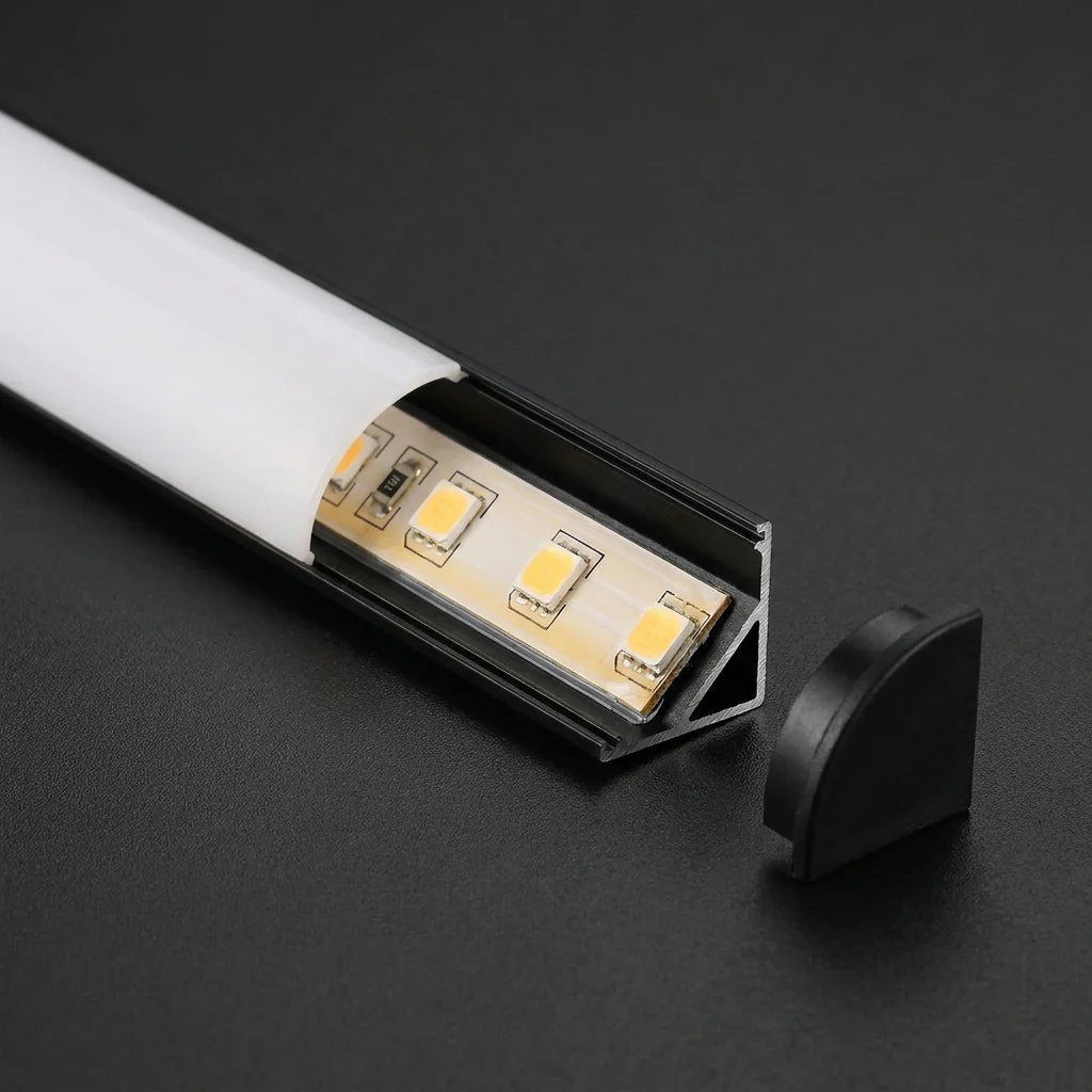 Black corner profile diffuser open showing LED strip and black end cap