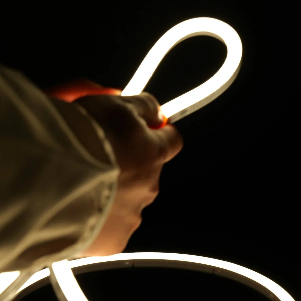 ATOM LED natural white 4000K 10x10mm side bend neon flex outlining a pergola frame outdoors — 48V IP67 waterproof