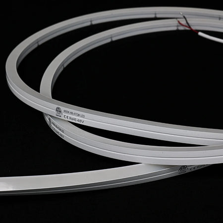 ATOM LED natural white 4000K 10x10mm side bend neon flex running along an outdoor step edge at dusk — 48V IP67 waterproof
