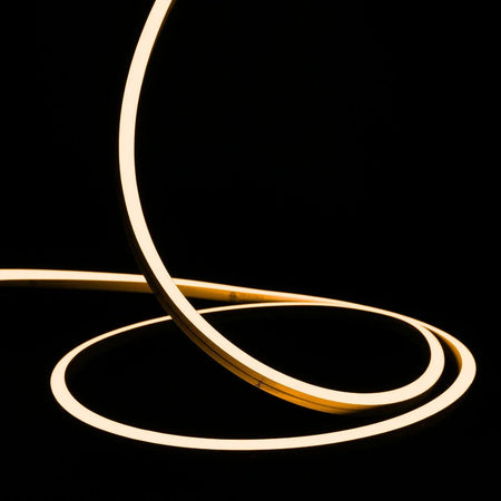 ATOM LED warm white 2700K 10x10mm side bend neon flex turning a 90° corner around an outdoor garden patio — 48V IP67 waterproof