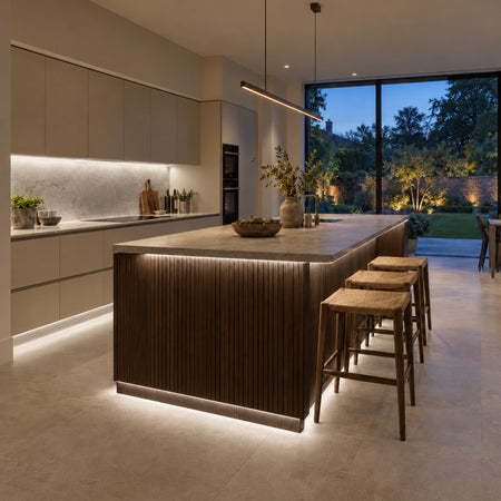 FreeCut mini neon flex 4000K natural white beneath kitchen cabinets and a fluted oak island
