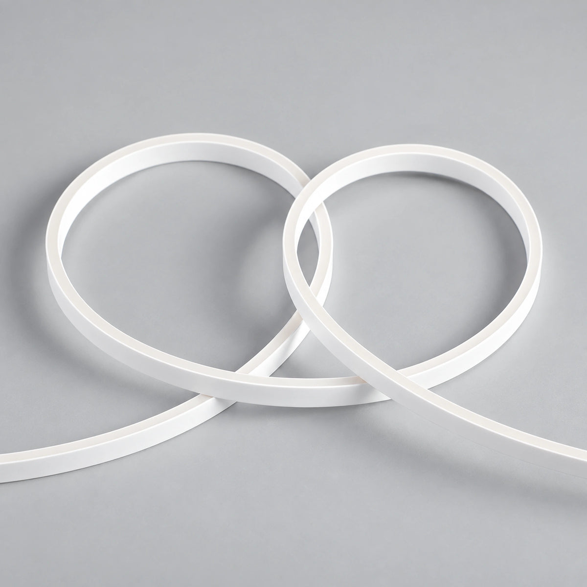 White silicone mini neon flex, switched off, showing flexible loops — reference illustration