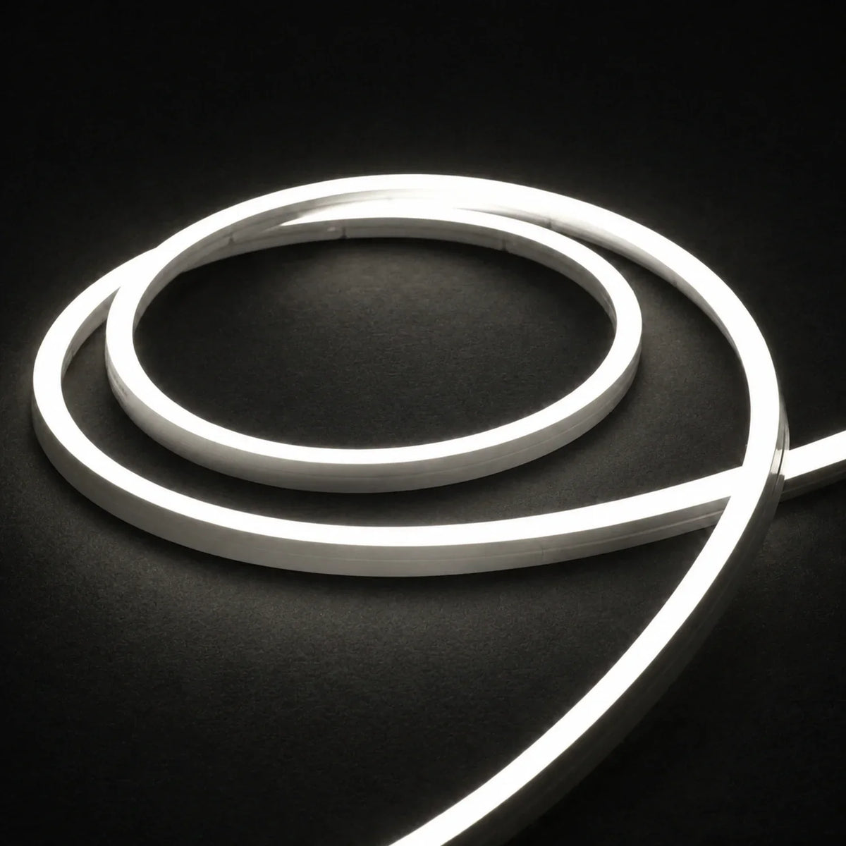 4000K side-bend Neon Flex coiled on a dark surface, colour-adjusted product photograph