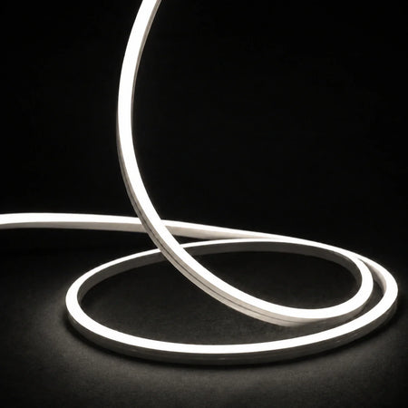 4000K side-bend Neon Flex raised in loops on a dark surface, colour-adjusted product photograph