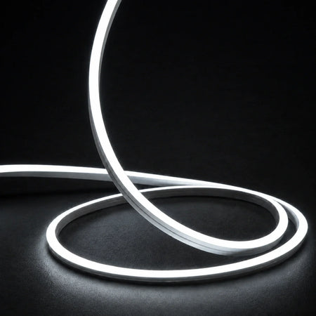 6000K side-bend Neon Flex raised in loops on a dark surface, colour-adjusted product photograph