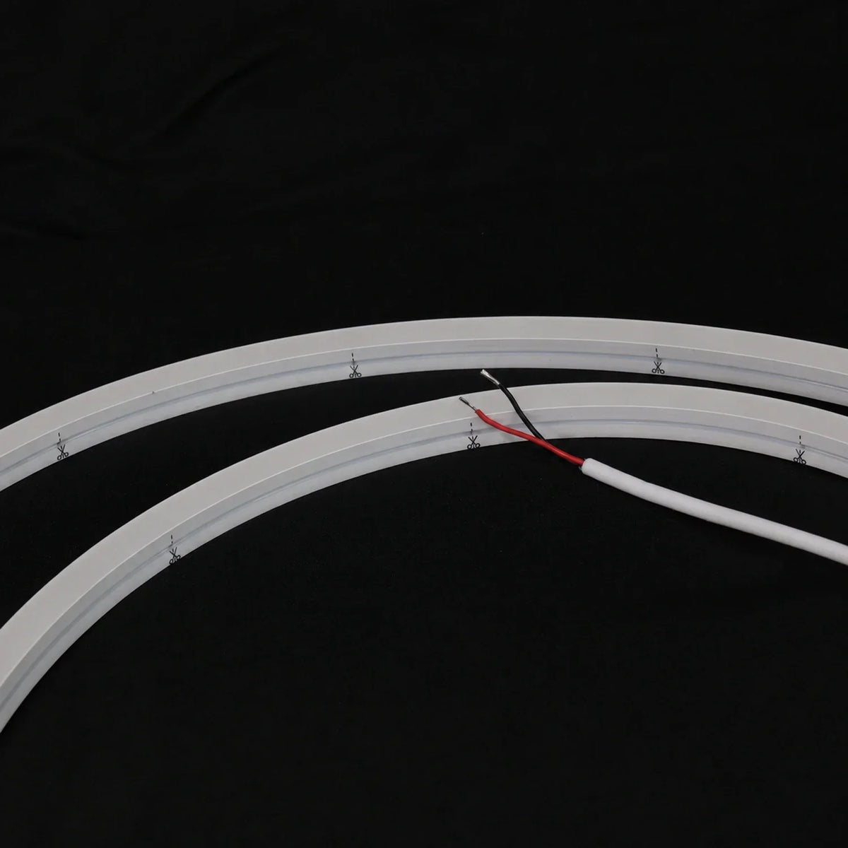 Unlit 15×15mm side-bend Neon Flex showing cut marks and two-wire lead