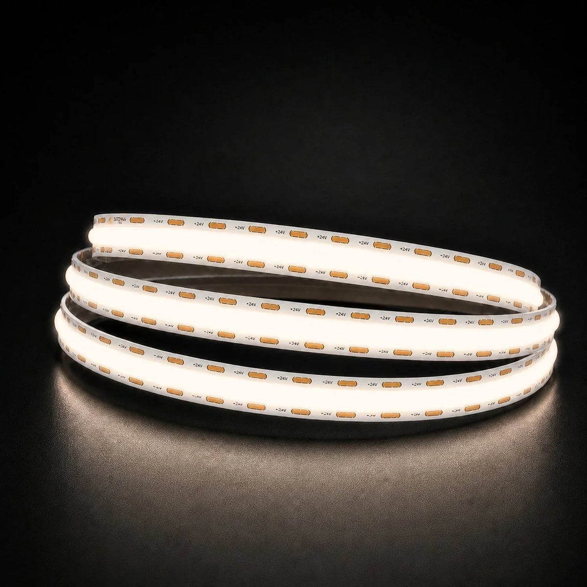 Natural White 4000K COB LED strip coil illuminated on a dark background, 24V DC and 10mm wide.