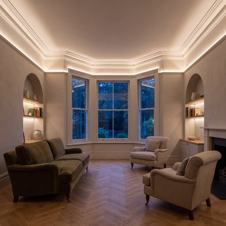 Warm White 2700K COB LED strip ceiling coving lighting in a large British living room in the evening; installation illustration.