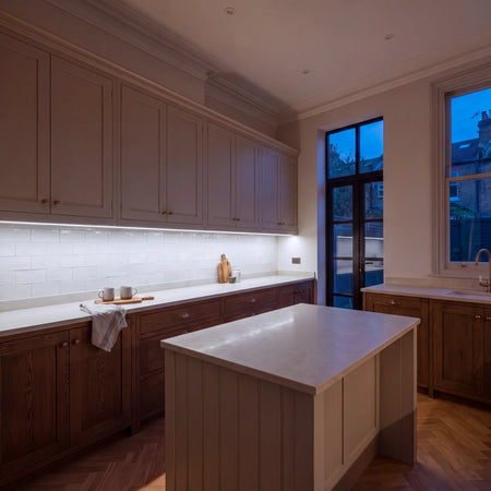 Cool White 6500K COB LED strip lighting beneath wall cabinets in a large British kitchen in the evening; installation illustration.