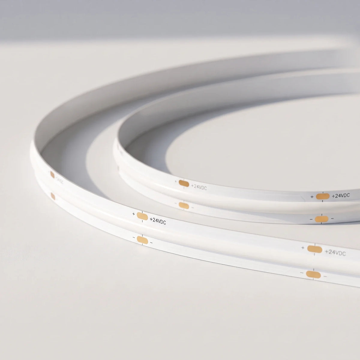 Unlit 10mm SCOB LED strip showing white board and 24V connection pads