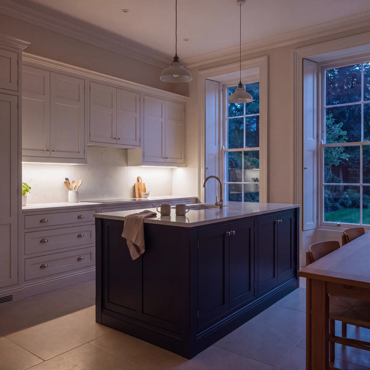 Natural White 4000K SCOB LED strip lighting beneath wall cabinets in a large British kitchen in the evening; installation illustration.