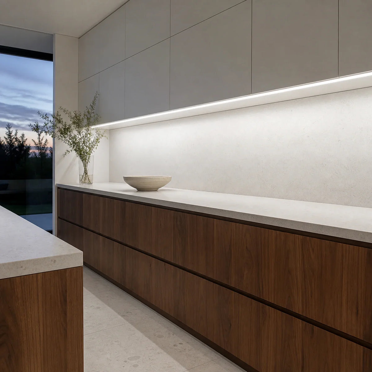 Illustrative white-and-walnut kitchen with cool-white 6500K SCOB LED lighting beneath cabinets over a dry preparation counter.