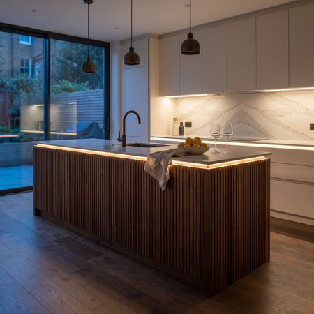 Warm White 3000K 24V 10mm SCOB LED strip installed beneath cabinets and around a British kitchen island; installation visual.