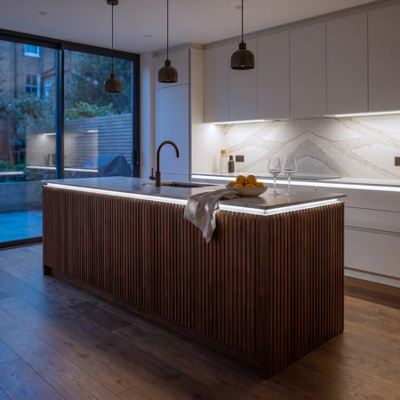 Daylight 5000K 24V 10mm SCOB LED strip installed beneath cabinets and around a British kitchen island; installation visual.